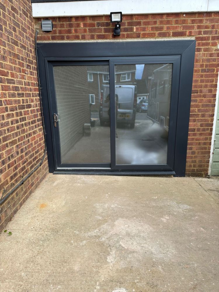 Modern black sliding doors installed by Construction Edge