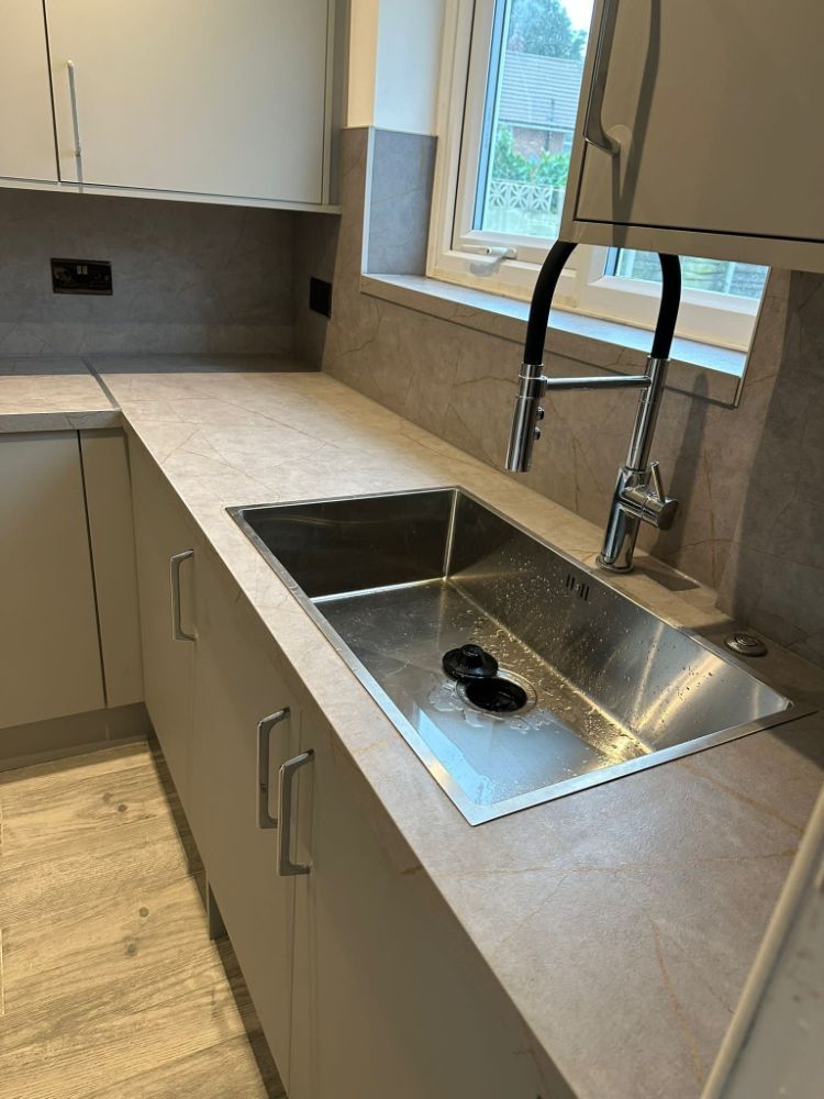 Brand new kitchen sink and worktops installed by Construction Edge