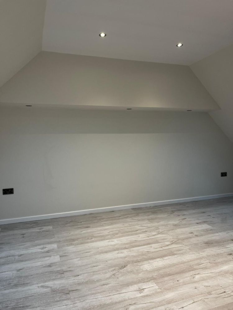 Full loft conversion with new flooring and plastered walls by Construction Edge