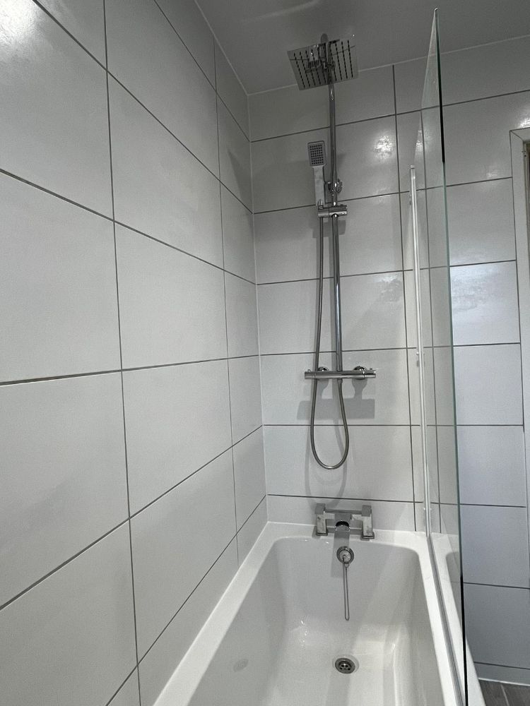 Installation of a shower, bath and bathroom wall tiles by Construction Edge